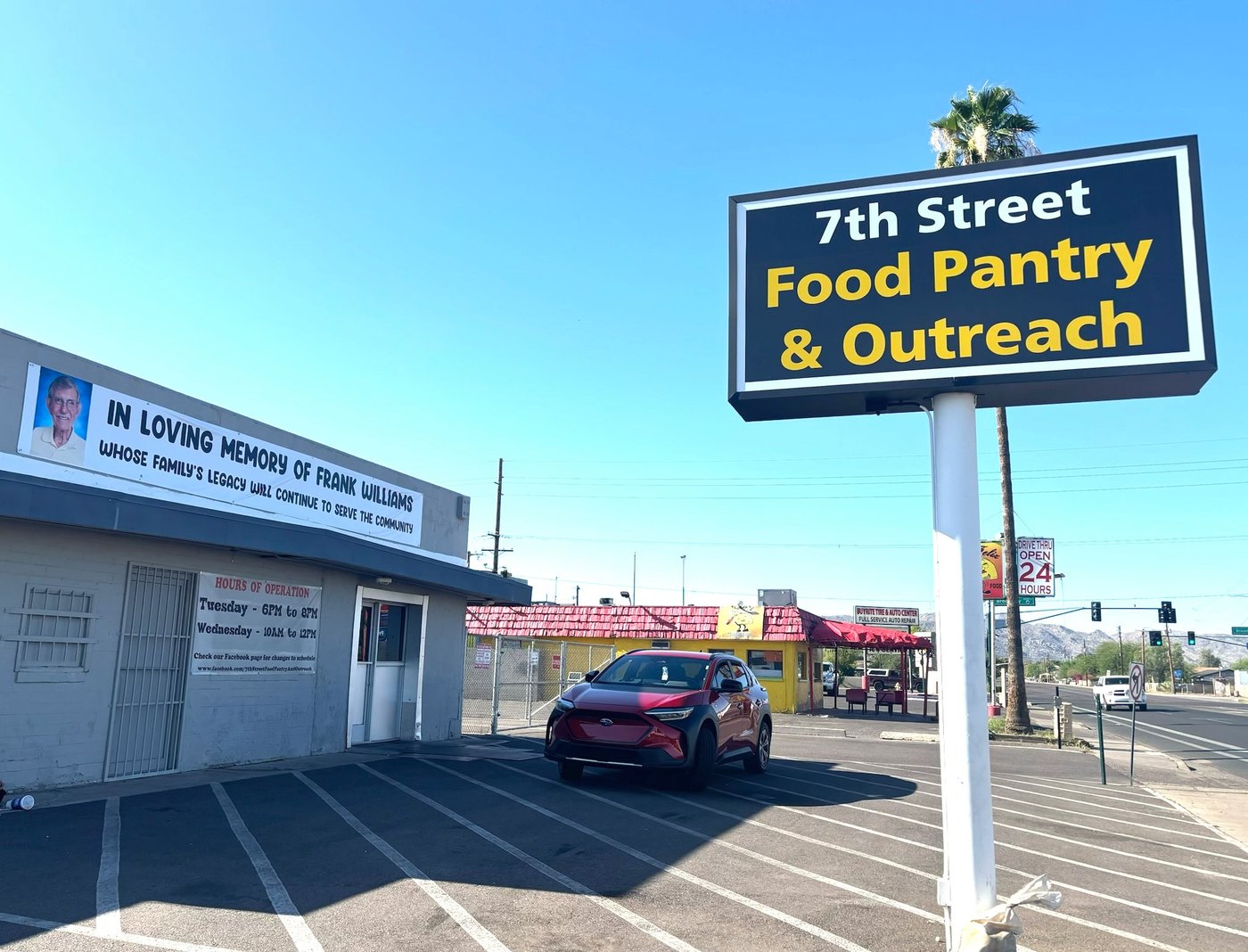 Memorial banner honoring Frank Williams at 7th Street Food Pantry
